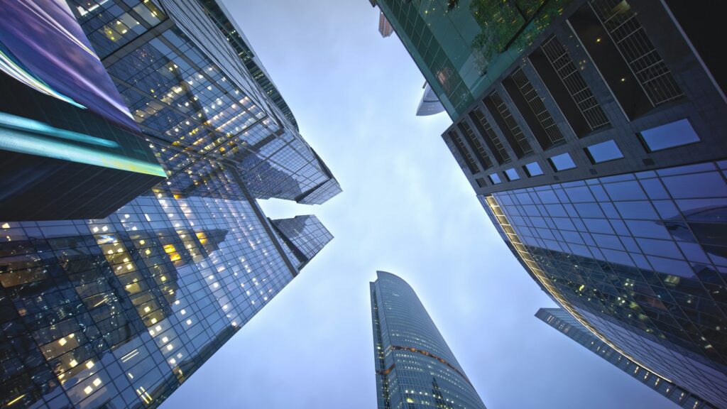 Looking Up in Down town of modern city Skyscrappers With clear skies